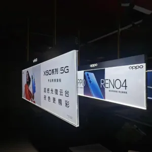 Illuminated advertising display for top placement